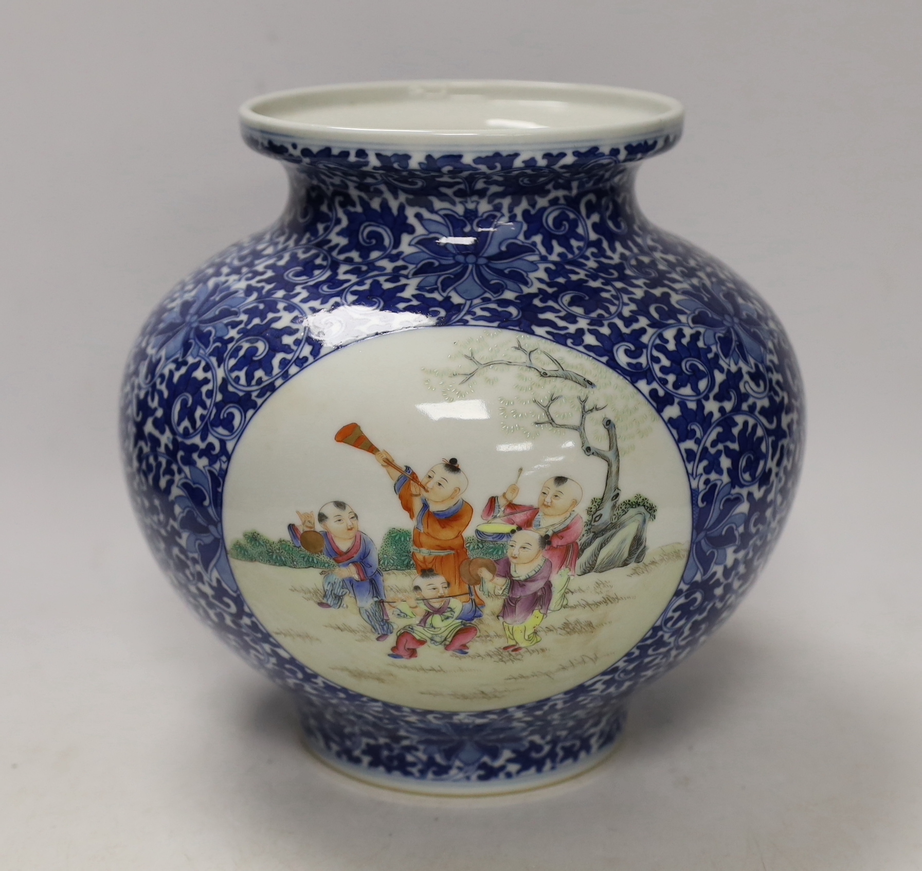 A Chinese enamelled blue and white jar, Qianlong mark, 22cm high